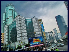 Tianhe Road, near Gangding Station. To the left is Nanfang International Mansion, a 48-storey hotel built in 1998 with a green glass exterior.  With a height of 201m to the spire, this was the second tallest building in Guangzhou upon completion.